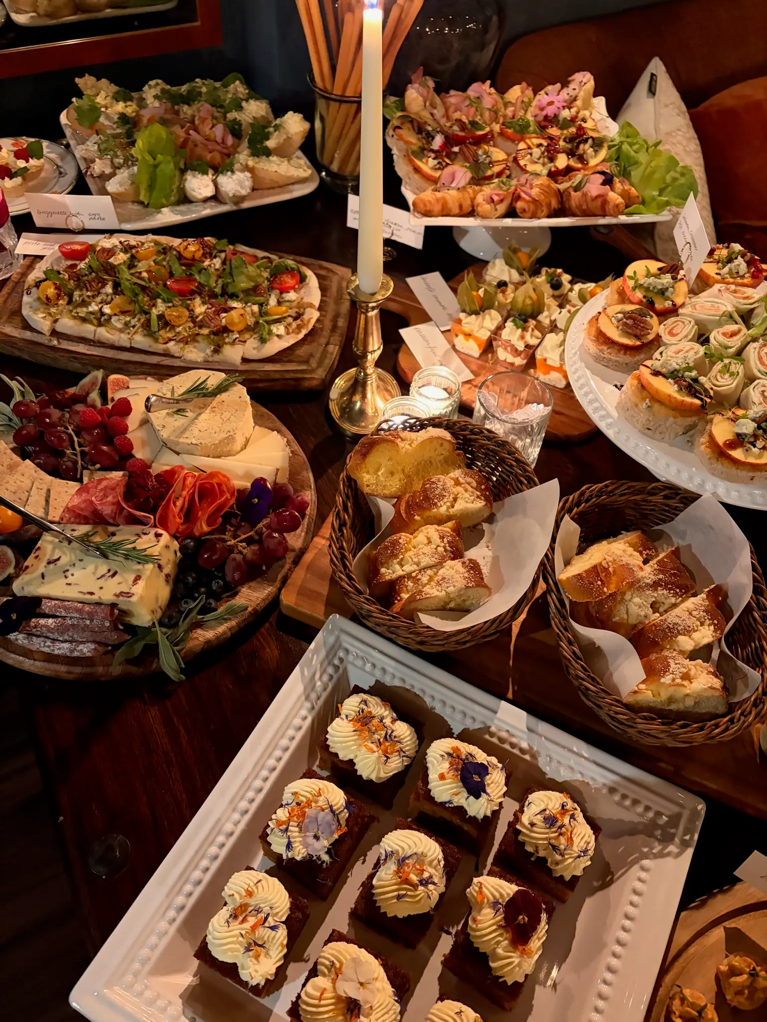 Event grazing spread with charcuterie, breads and cakes
