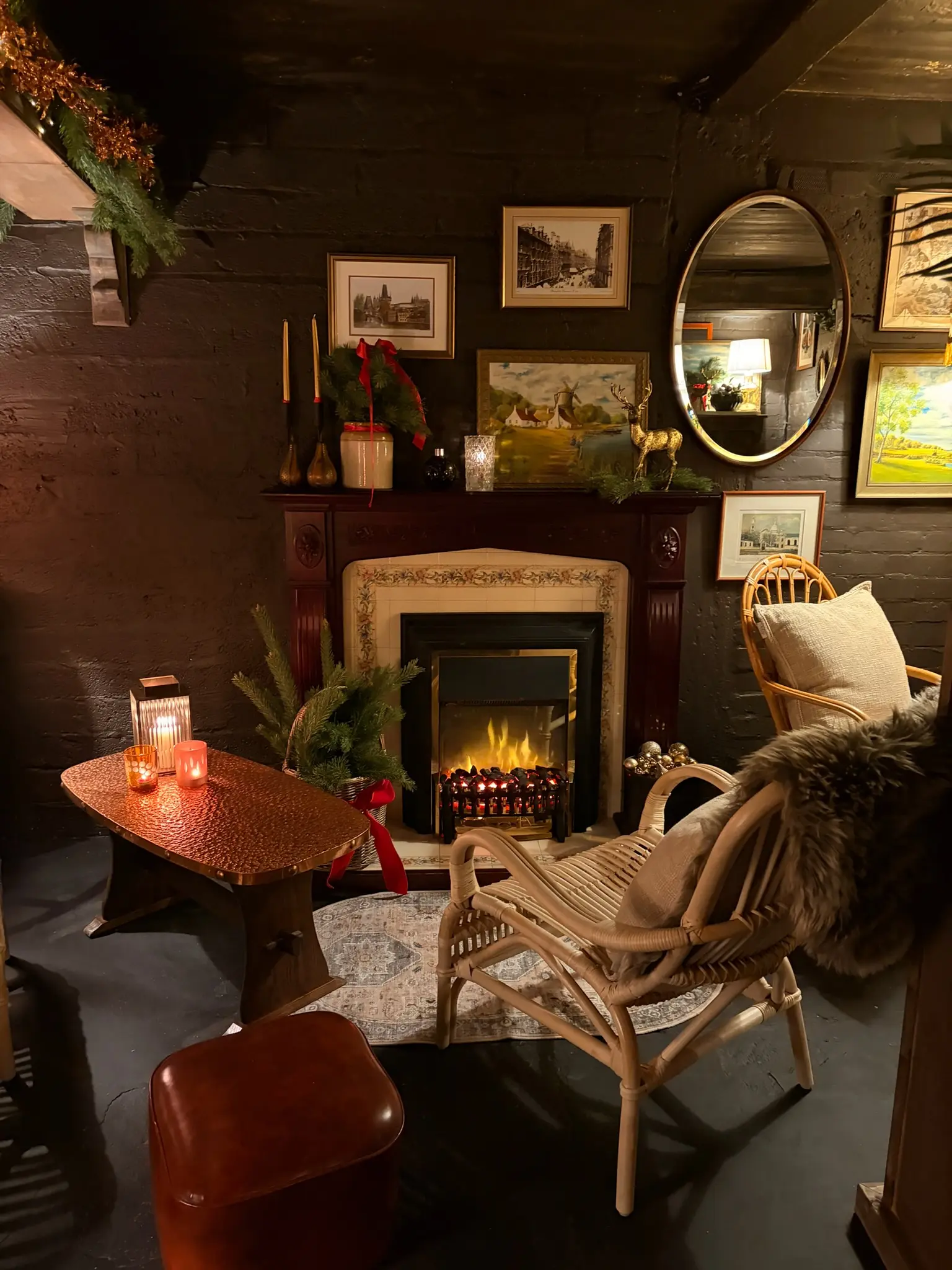 Christmas fireplace corner with rattan chair and festive decorations