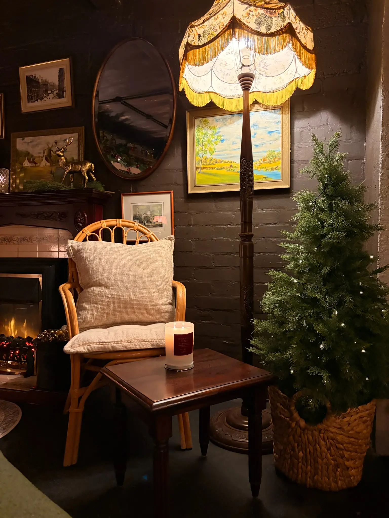 Vintage floor lamp by the fireplace with Christmas tree and candle