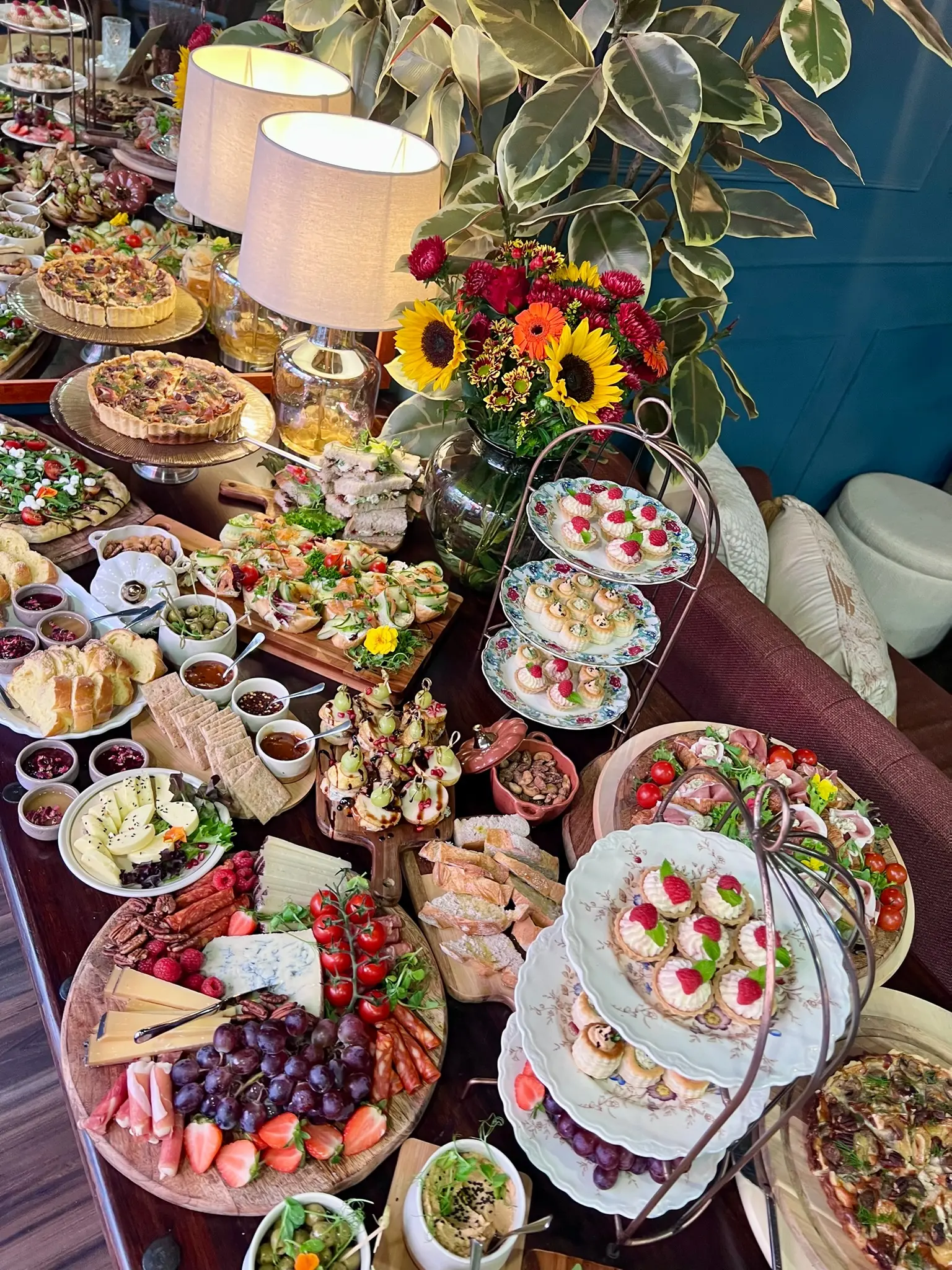 Abundant brunch spread with quiche, charcuterie and finger foods