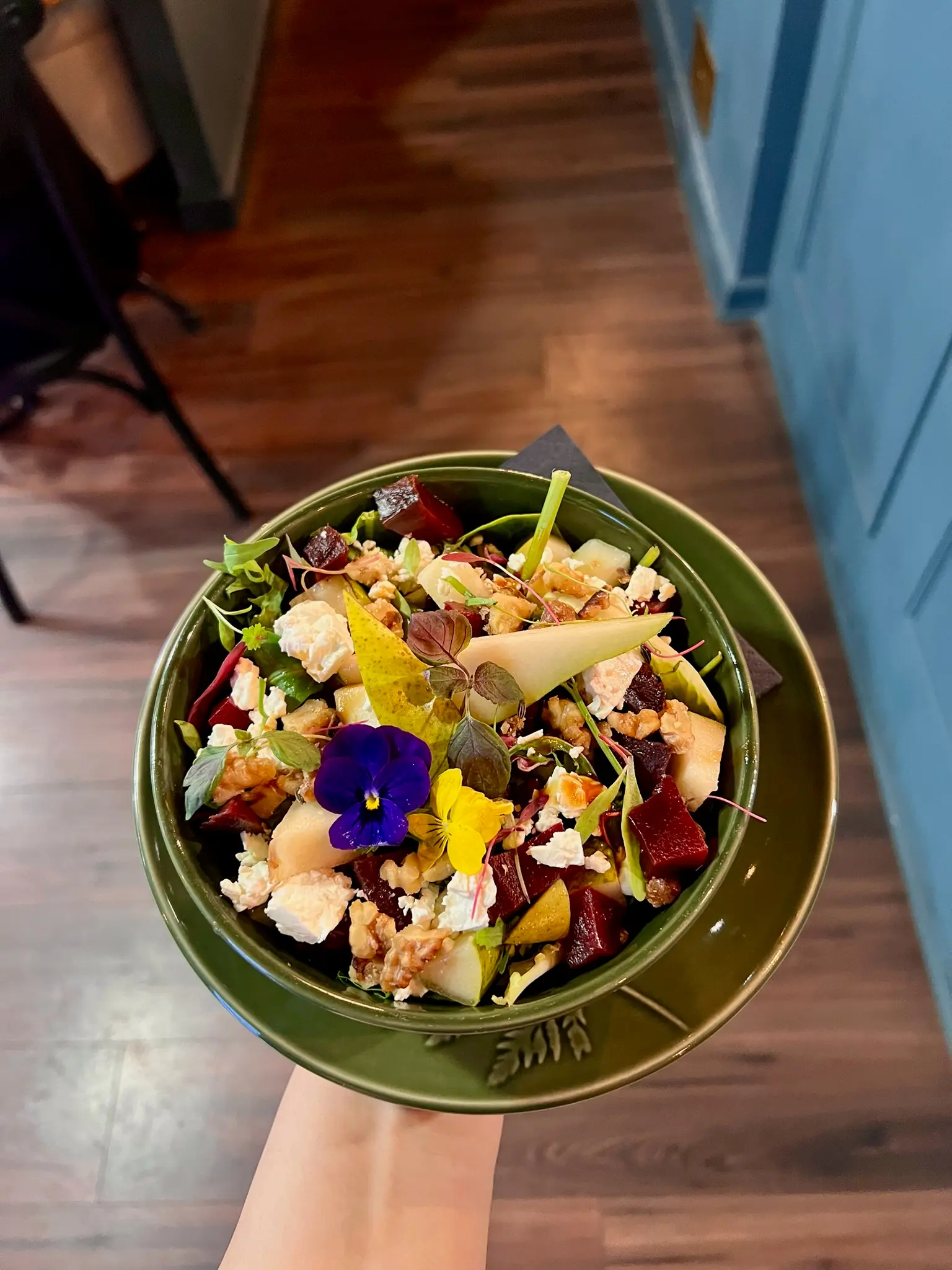 Beetroot and pear salad with edible flowers and goat's cheese